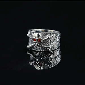 Gothic punk skull ring for men with red gemstone eyes and vintage silver finish