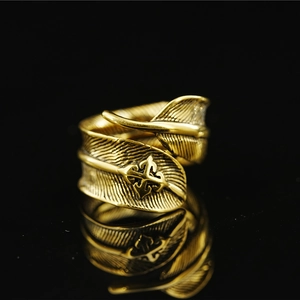 Vintage golden feather ring with embossed cross floral pattern and antique finish