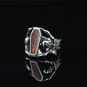 Gothic skull coffin ring in vintage silver metal with retro punk aesthetic details