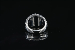 Detailed view of silver bat ring with vintage textures and gothic punk engraving