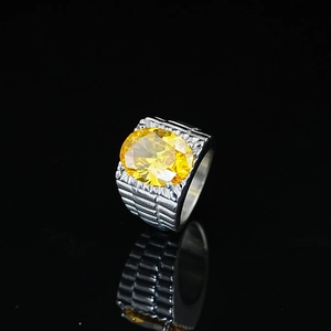 Elegant silver stainless steel ring with a large oval yellow zircon and textured band