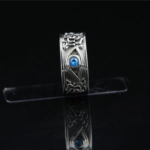 Vintage stainless steel Eye of Horus ring with rose relief and blue gemstone