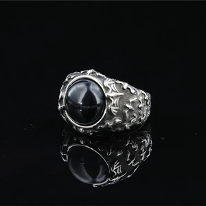 Vintage gothic bat ring featuring a large black gemstone and intricate silver engravings