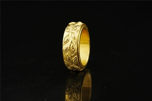 Detailed relief of Eye of Horus on a gold titanium steel band with elegant reflection