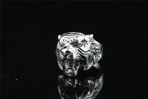 Macro shot of a roaring lion head ring in vintage silver stainless steel with sharp details