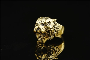 Detailed close-up of golden roaring lion head ring with intricate metal textures and fangs