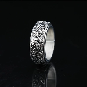 Titanium steel ring with Eye of Horus engravings and vintage punk oxidized finish