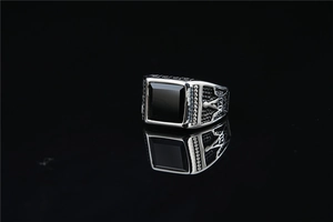Detailed relief carving and black square gemstone on men's vintage silver ring