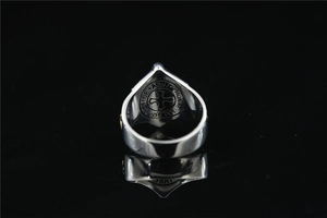 Macro shot of stainless steel ring interior with engraved Justice, Honor, and Valor text