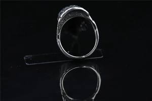Detail view of the polished inner band and textured back of a vintage eagle head ring