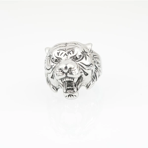 Hip hop style stainless steel lion head ring with vintage finish on white background