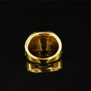 Retro golden square Masonic ring with 999 engraving on a black mirror background