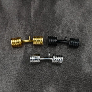 Set of three solid dumbbell pendant necklaces in gold, black and silver for fitness enthusiasts