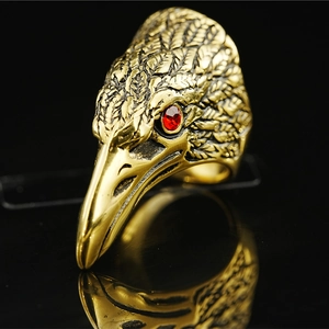 Vintage golden eagle head ring with detailed feathers and red rhinestone eyes for men