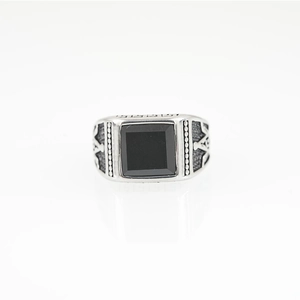 Vintage silver men's signet ring with a square black stone and geometric carving
