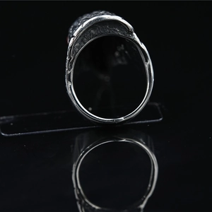 Vintage oxidized silver eagle head ring for men with red rhinestone eyes and punk style