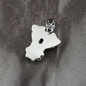 Brushed metal back detail of a retro punk motorcycle engine pendant necklace