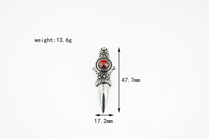 Detailed size view of silver punk dagger pendant with red gemstone and textured scales