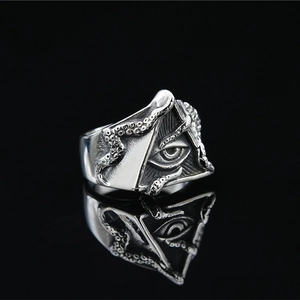 Gothic punk silver octopus tentacle ring featuring the Eye of Horus pyramid design