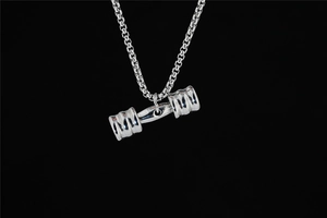 Detailed view of a silver solid dumbbell pendant on a steel box chain for fitness fans