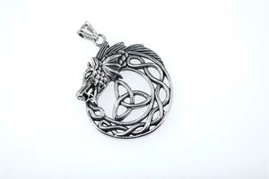 Close-up of vintage viking dragon pendant with intricate celtic knot and steel finish