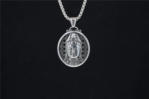 Detail of silver stainless steel Guanyin pendant with hollow frame and beaded chain
