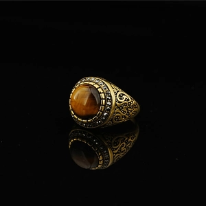 Vintage gold men's tiger eye ring with black rhinestones and intricate side carvings