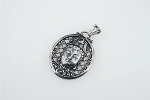 Macro view of vintage titanium steel Guanyin pendant with hollow cloud pattern