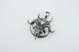 Detailed close-up of a Gothic Baphomet goat head pendant with pentagram in a steel ring