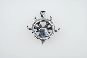 Detailed macro shot of gothic goat head pendant with textured horns in antique silver
