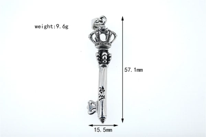 Detailed measurement of vintage gothic crown key pendant with engraved character and fleur-de-lis