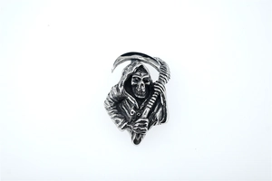 Detailed close-up of a silver Grim Reaper skull pendant with a scythe in punk style