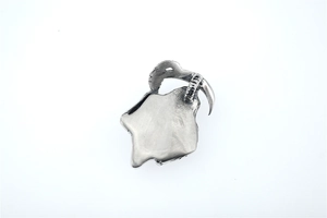 Detailed view of a vintage silver gothic goat skull pendant with blackened antique finish