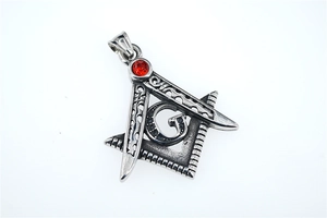 Macro view of Masonic compass square pendant with red zircon and vintage silver finish