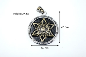 Detailed view of silver disc pendant featuring golden hexagram and sun totem patterns