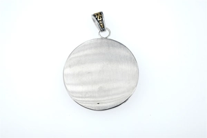 Detailed close-up of a silver hexagram pendant with brushed metal texture and golden bail