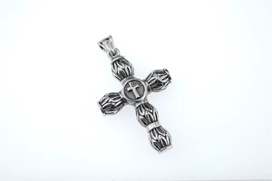 Detail of vintage cylindrical cross pendant in oxidized stainless steel for men