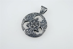 Detailed view of silver Viking pendant with intricate Celtic knot hollow geometric patterns