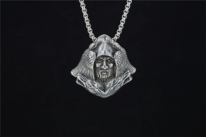 Macro shot of vintage Viking Odin pendant with winged helmet and antique silver finish