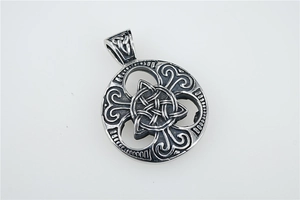 Macro detail of Nordic Viking hollow triangle knot pendant in silver steel