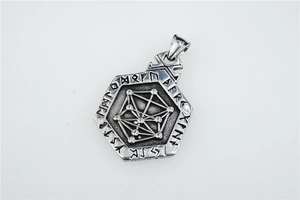 Detailed macro view of a Viking hexagon pendant featuring Nordic runes and Celtic geometry