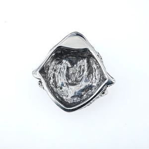 Vintage style irregular silver ring with hammered texture for a rugged hip hop look
