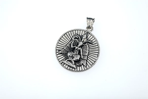 Close-up of retro Baphomet relief pendant in stainless steel with gothic details