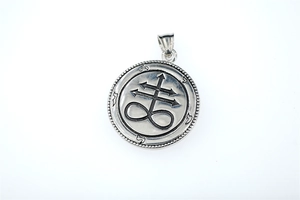 Detailed view of round Leviathan Cross pendant in vintage stainless steel with embossed details