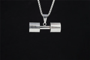 Detailed view of polished silver dumbbell pendant necklace with high-gloss steel finish