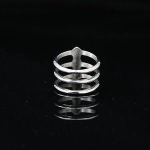 Minimalist silver triple-layer hollow ring with sleek metallic finish and reflection