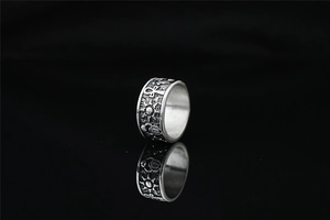 Macro shot of Ankh symbol and sun rays engraved on a vintage Egyptian steel ring