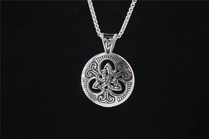 Close-up of vintage Celtic knot pendant with triquetra detail on steel necklace chain