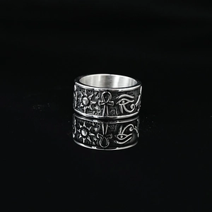 Vintage stainless steel ring featuring Egyptian Horus Eye and Ankh symbols with reflections