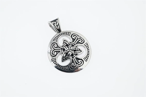 Close-up of vintage Celtic Knot pendant in silver steel with oxidized finish detail